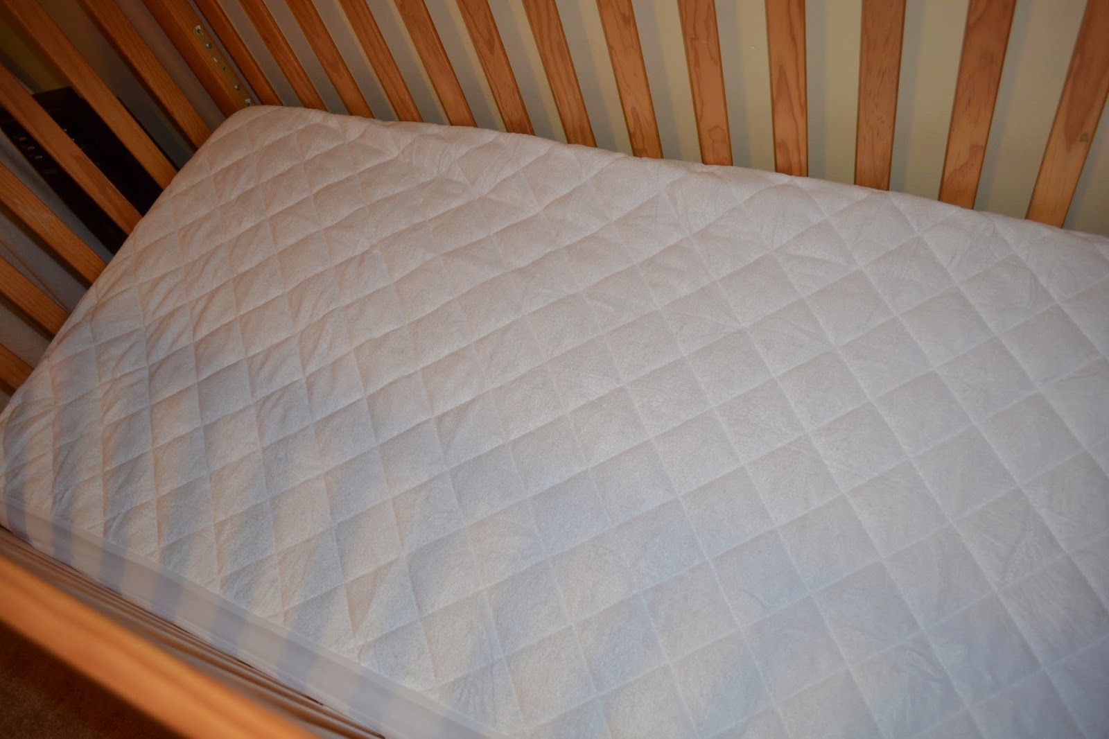 crib mattress protector safety