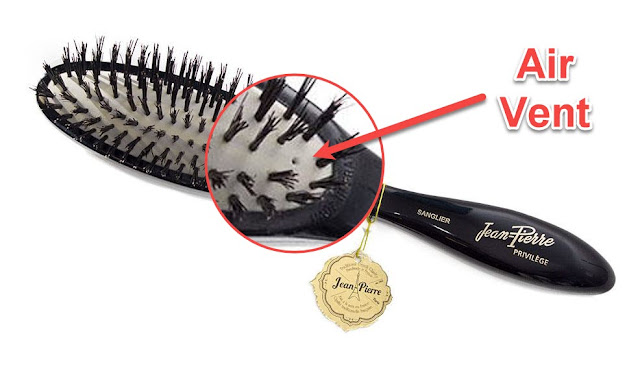 Why does some boar brushes use a cushion?