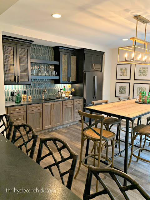 Basement bar with wood and blue cabinets 