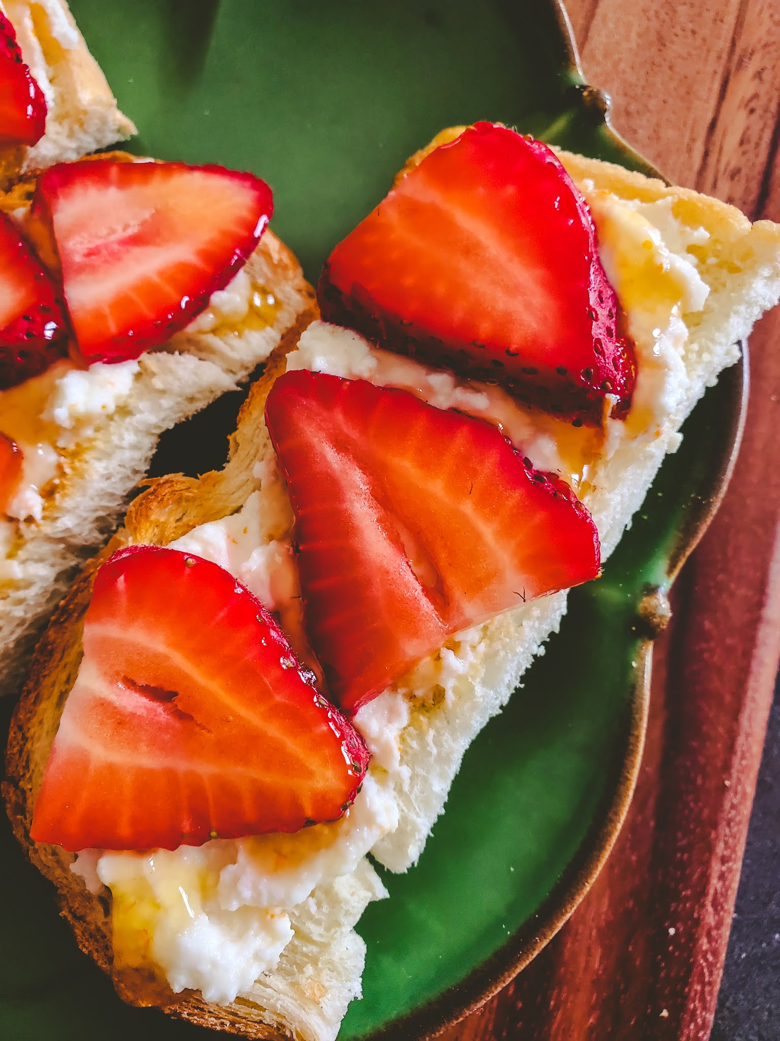 Slice of Southern Tangerine Ricotta Toast with Strawberries and Honey