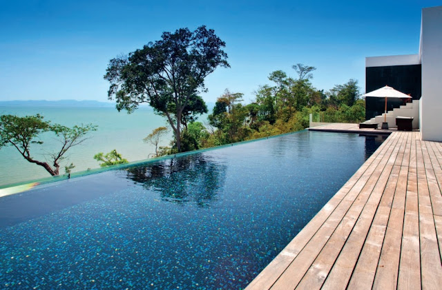 A glittering infinity pool stretches along the upper deck
