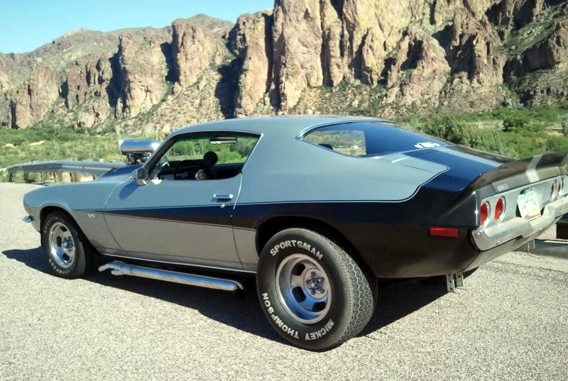 Just A Car Guy Muscle cars in full effect, jacked in back with huge back tires and Cragars