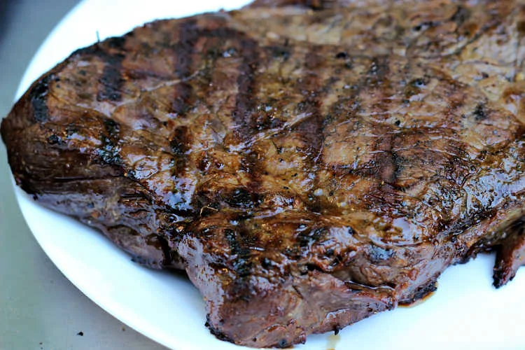 Killer London Broil by Renee's Kitchen Adventures on white plate resting