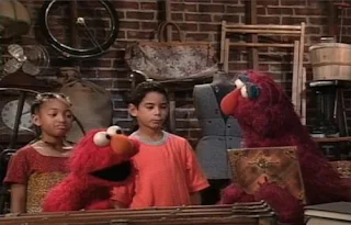 Elmo, Telly and two children find a magic cookbook. They call Jean the Genie. Sesame Street Elmo's Magic Cookbook