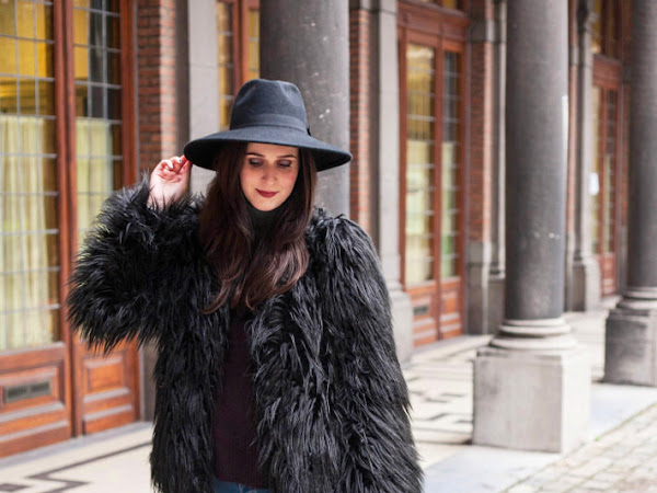 Outfit: shaggy faux fur coat, wide brim hat