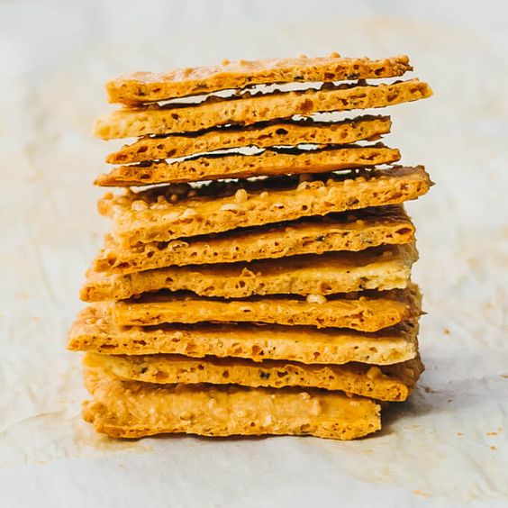 Here’s the best recipe for making easy low carb cheese crackers using almond flour. They’re baked in the oven using parchment paper. They’re great for keto, grain free, gluten free, and lchf diets. They’re sturdy and crispy, great for dips and replace the role of tortilla chips. Click the pin to find the recipe, nutrition facts, cooking tips, & more photos. #keto #lowcarb #recipe #healthy #glutenfree / glutenfree snacks ideas / healthy recipes