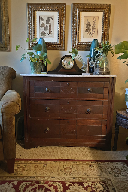 antique dresser as storage in small space living room