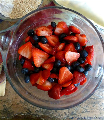 Berry Pie Crisp is a summertime favorite. An assortment of berries, mixed with a bit of toffee and baked as a pie, crisp hybrid. | Recipe developed by www.BakingInATornado.com | #recipe #pie