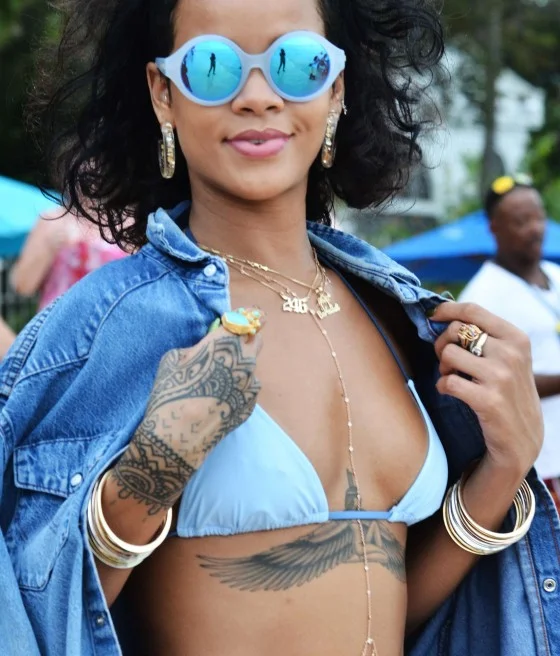 Rihanna flaunts shades of blue in a 40s style bikini at Barbados beach