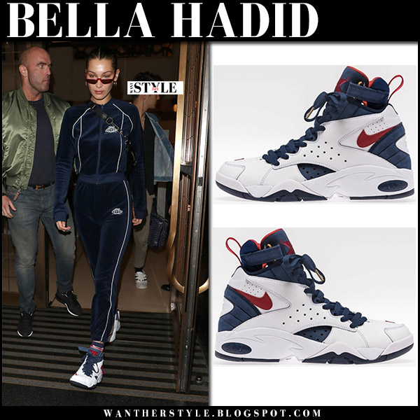 Bella Hadid in blue track suit white sneakers and red sunglasses in