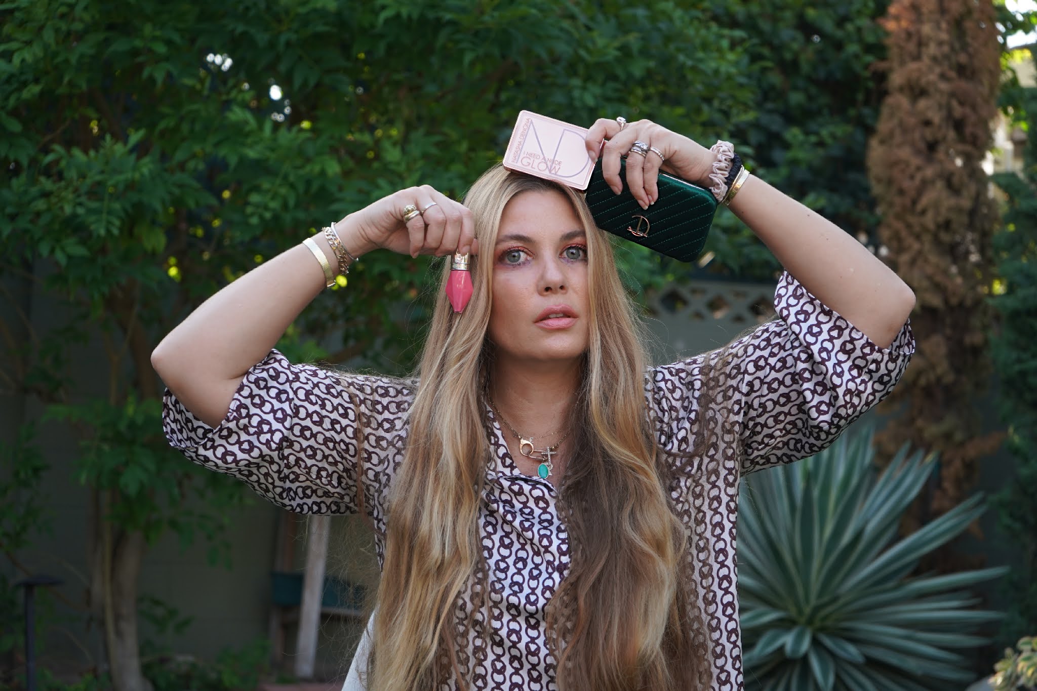 woman holding makeup and pouch 