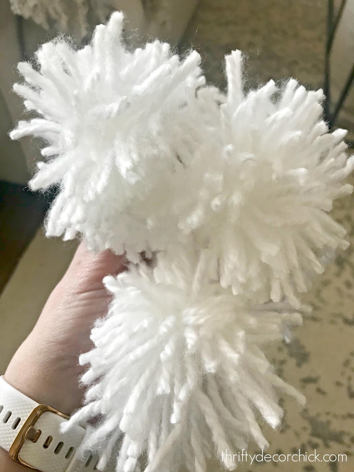 white yarn pom poms for wreath
