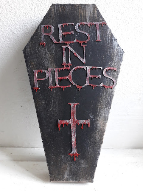 Coffin treat box with Rest In Pieces written on it and a cross both dripping with blood.