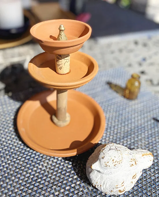 terra cotta tiered tray with cork and spool