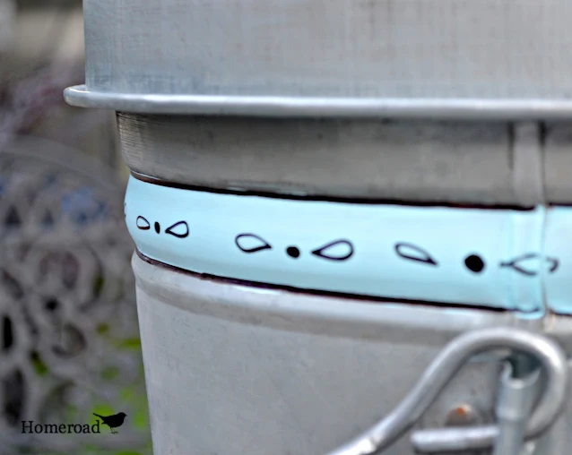 garbage can with antiquing and patio paint stripe