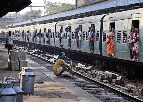 Describe a scene at the railway station when a train arrives picture