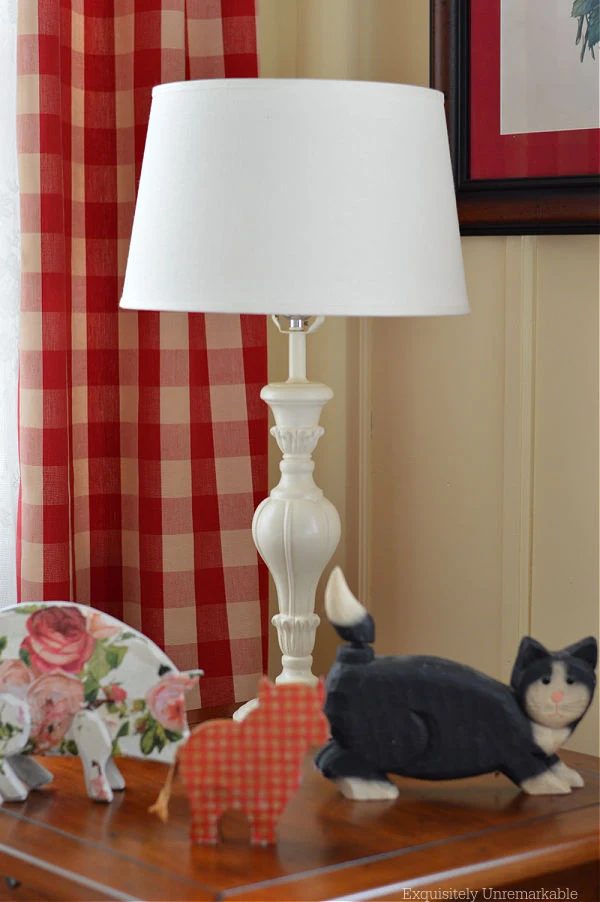 New lamp on a table with wooden animal figures