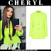 Cheryl in neon yellow blazer and crop top