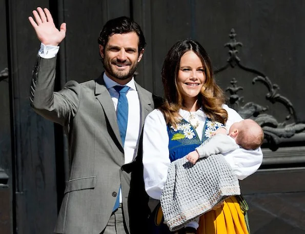 rince Carl Philip of Sweden, Princess Sofia of Sweden and son Prince Alexander of Sweden open the gate of the Royal Palace for the National Day Celebrations