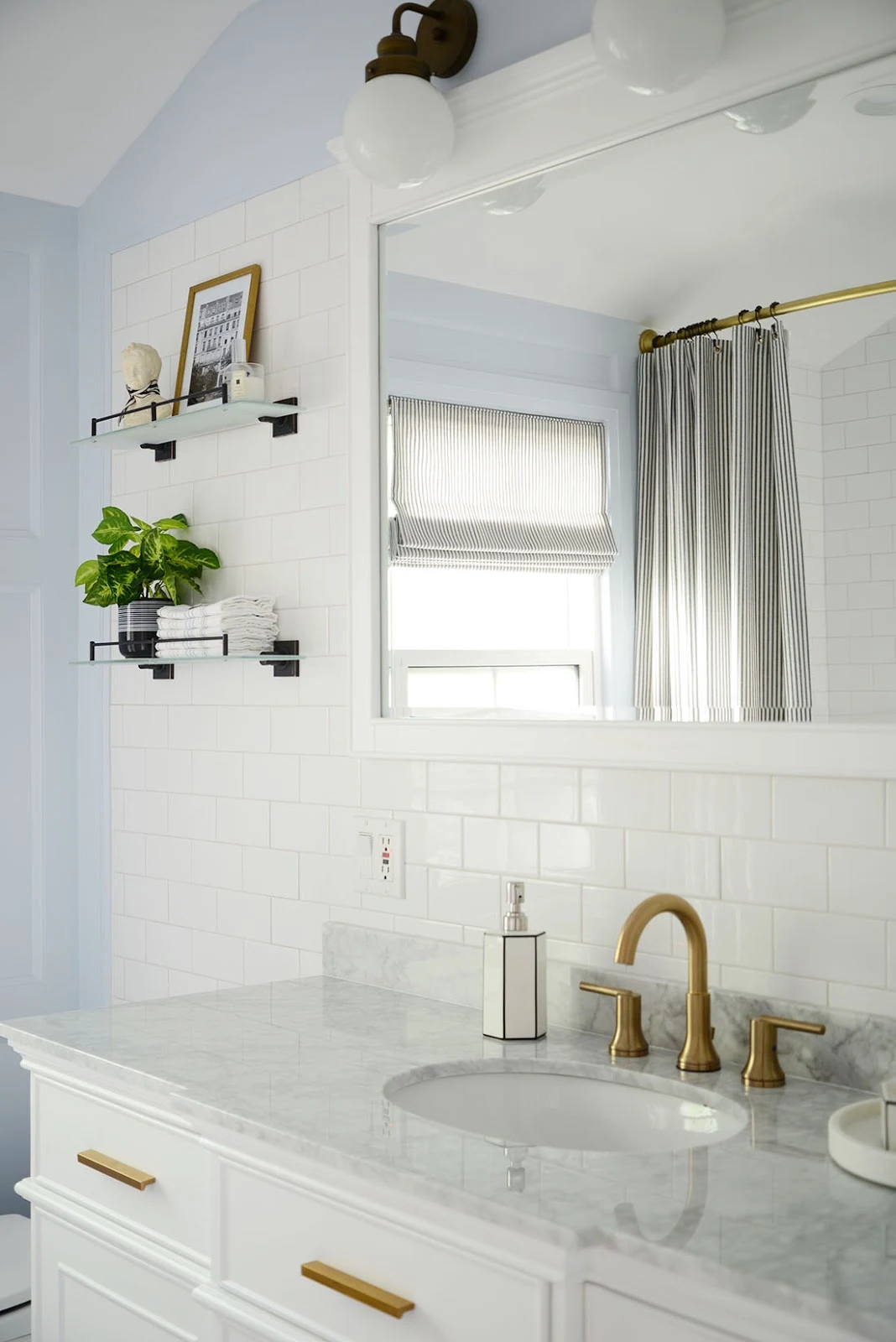 french style bathroom, home depot bathroom remodel, light blue bathroom, single sink white vanity, diy wall panelling in bathroom