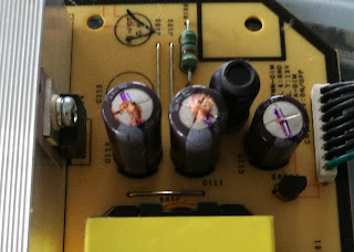 Two burst and one bulging capacitors