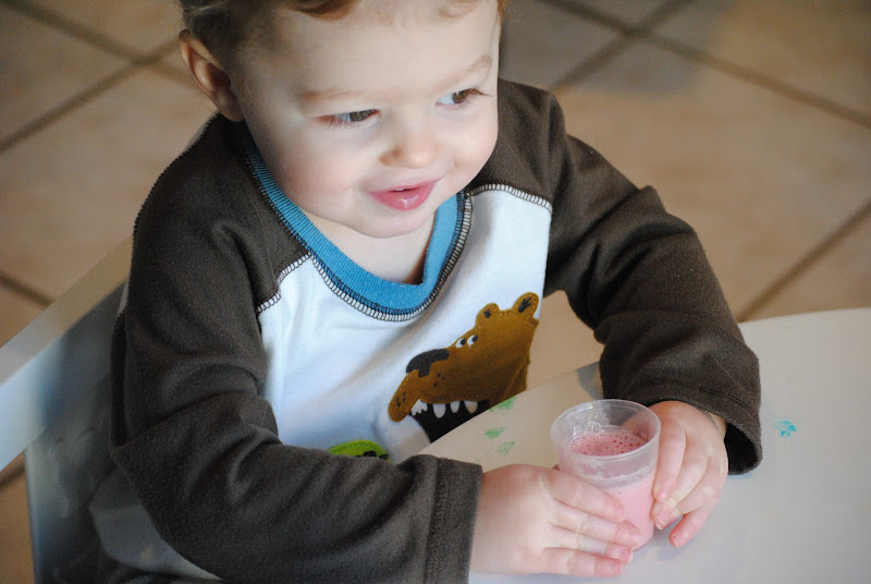 Little guy drinking a smoothie