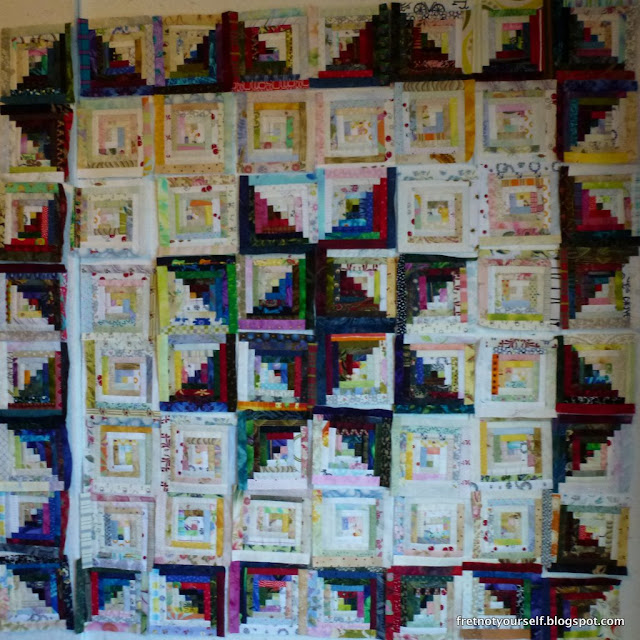 Log Cabin quilt, Medallion variation Half-inch logs create an Ohio Star in the center of this medallion quilt.