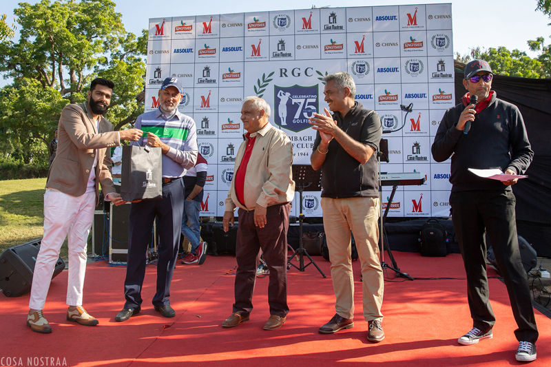 Tanuj Vijay on behalf of  Cosa Nostraa with Captain Yogendra Singh Shekhawat Presenting the award to Best Player of the Tournament Dr. H.S. Kang