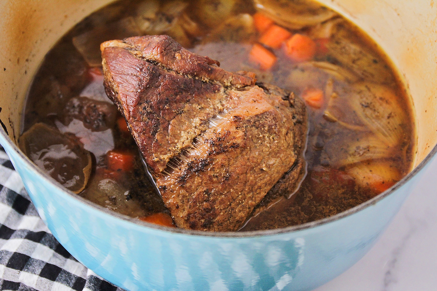 This perfect pot roast is tender, savory, and delicious, and so easy to make! It's the perfect comfort food meal!