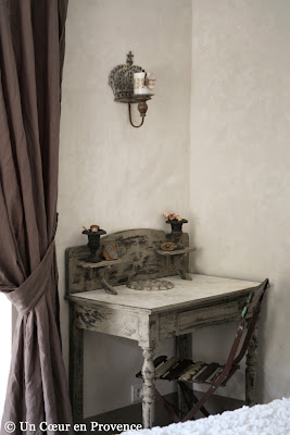 Patinated table in a room of the french guest house Un Cœur très Nature