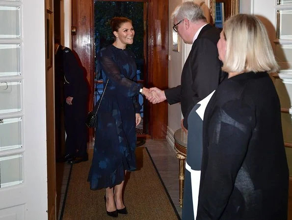 Crown Princess Victoria wore StarStudio PR Baroque pearl earrings, a new printed dress by Rodebjer. HM Dark blue dress