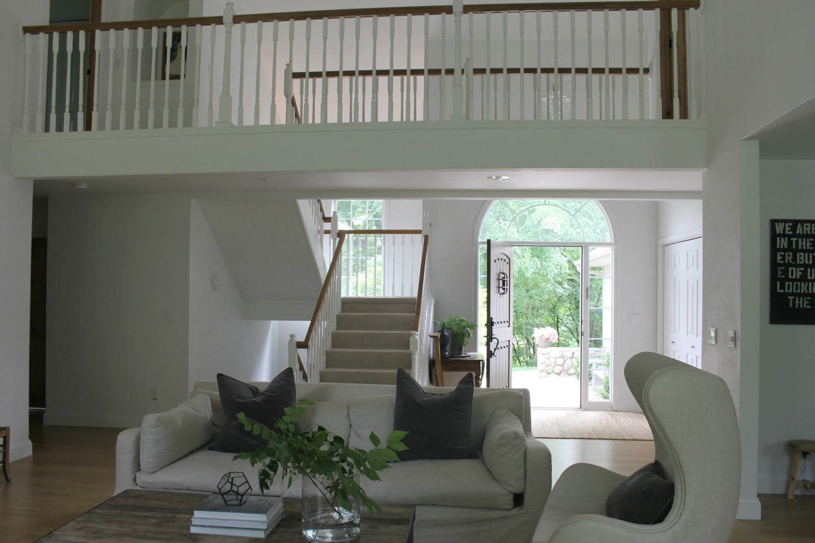 Living room with Benjamin Moore white paint on walls. Hello Lovely Studio. Come see renovation photos in Before & After: My Home Renovation.