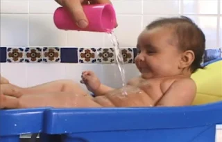 A video clip then shows children and babies taking a bath. Sesame Street Elmo's World Bath Time
