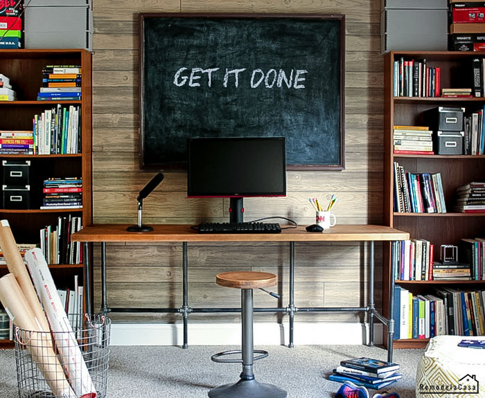 basement desk made of pipes - play room with chalkboard and shelves