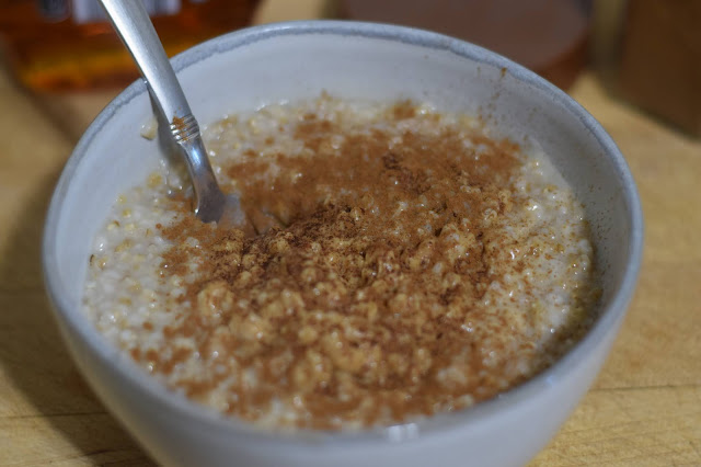 Cinnamon being added to the steel cut oats.