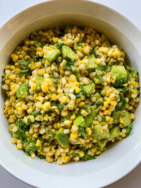Niblets of grilled corn mixed with avocado, chilli, cilantro, and a dressing