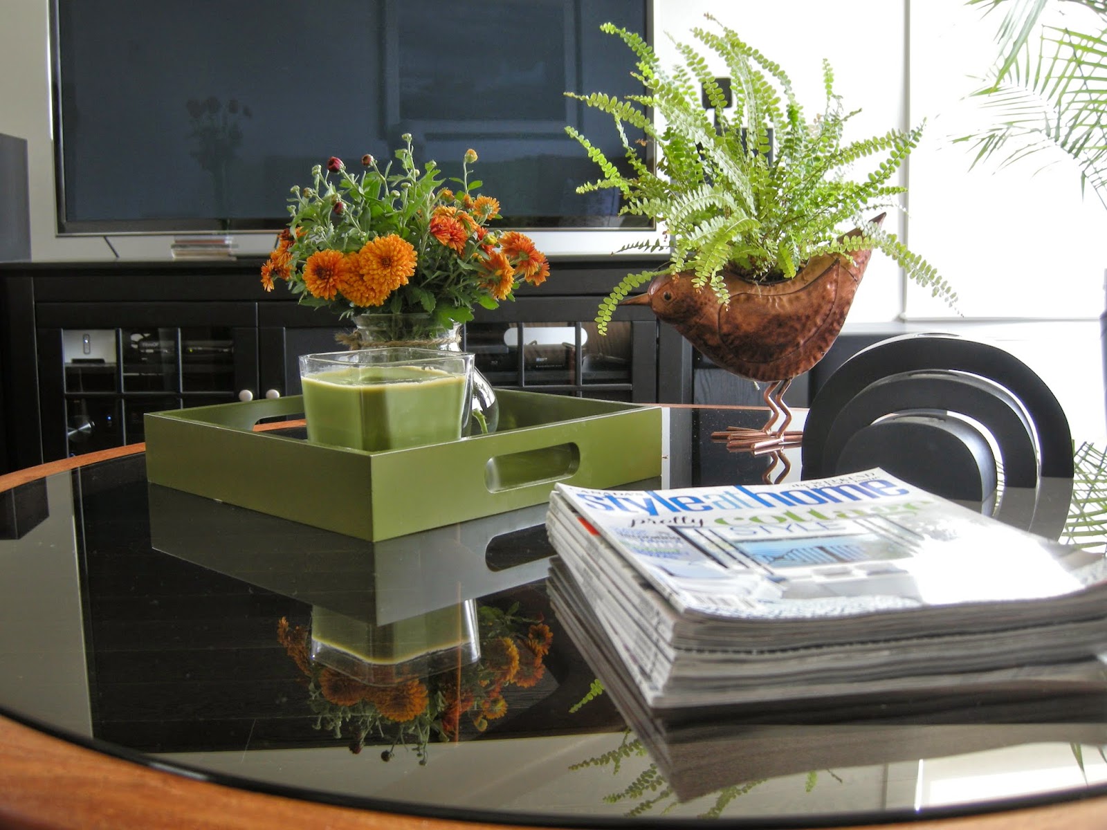 coffee table vignette, fern, copper bird planter, green tray