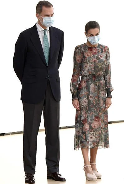 Queen Letizia wore a floral print midi dress from Zara, and canvas espadrille wedges by Macarena, Queen wore a gold earrings