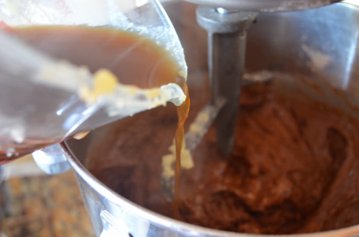 Hot Coffee being poured into Chocolate Cake Batter.