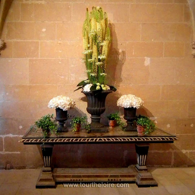 Flower arrangement in the Chateau de Chenonceau, Indre et Loire, France. Photo by Loire Valley Time Travel.