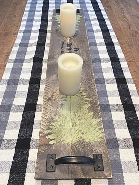 Candles on wooden table runner