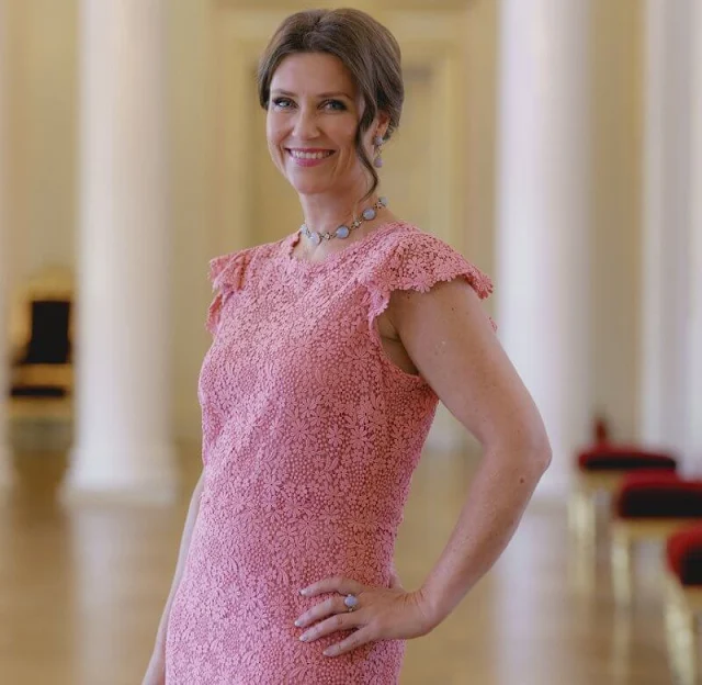 Princess Martha Louise wore a pink lace dress by Valentino. Emilio Pucci blue lace blouse. Crown Princess Mette-Marit wore the same dress