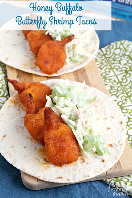 Crispy breaded shrimp are tossed in a homemade honey buffalo sauce & then wrapped up in warm flour tortillas with a creamy Ranch coleslaw in these Honey Buffalo Butterfly Shrimp Tacos.