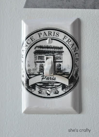 Use vinyl decals to decorate light switch cover in Paris themed teen girl bedroom