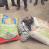 Photos: Man disgraced after buying two bags of rice with fake Naira notes in Lagos