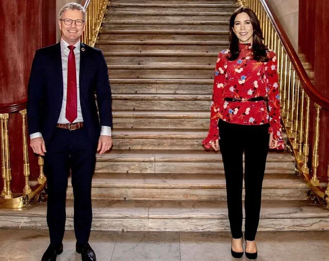 Crown Princess Mary wore a lindsey floral print mock-neck ruffle sleeve blouse from Erdem, and billie black pumps from Jimmy Choo