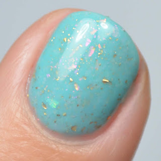 pastel green nail polish with color shifting flakies
