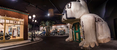 A bulldog-shaped building is displayed as part of a replica 1930s street scene.