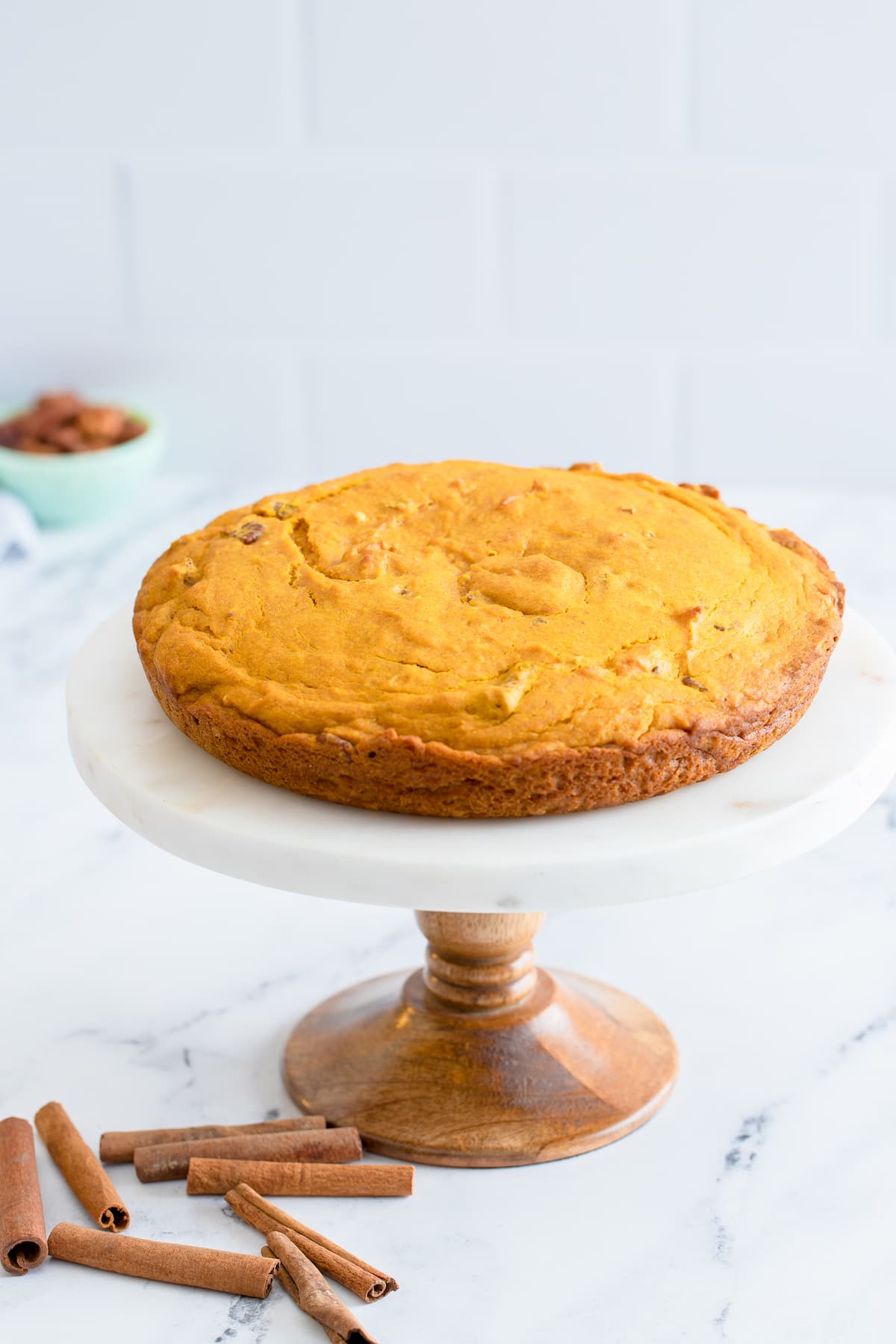 Pumpkin Crunch Snacking Cake on a cake stand.