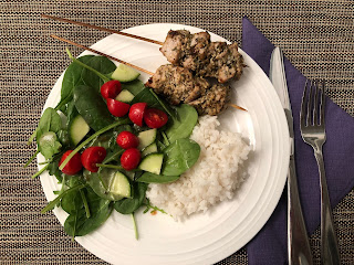 Greek marinated pork kabobs with garden salad and rice